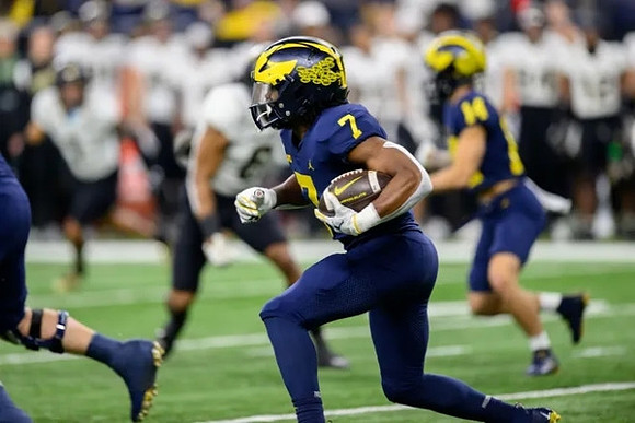 Donovan Edwards (7) and Roman Wilson (14)