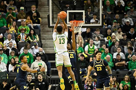 Nimari Burnett (4), Morez Johnson Jr. (21), and Yaxel Lendeborg (23)