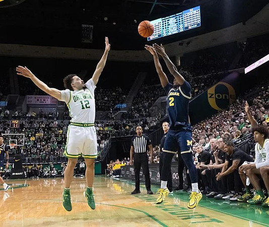 L.J. Cason (2) and Oregon Head Coach Dana Altman