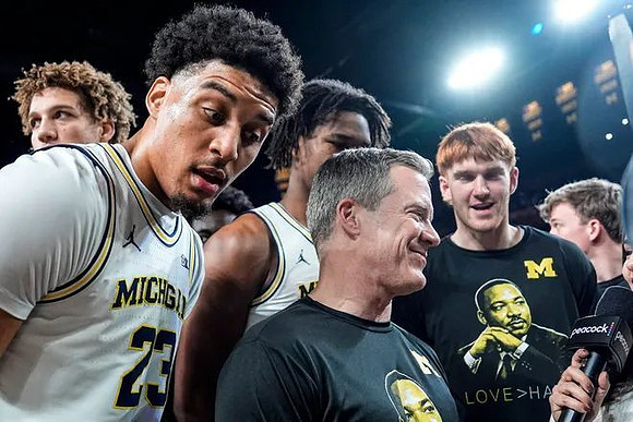 Dusty May, Yaxel Lendeborg (23), and Michigan Team