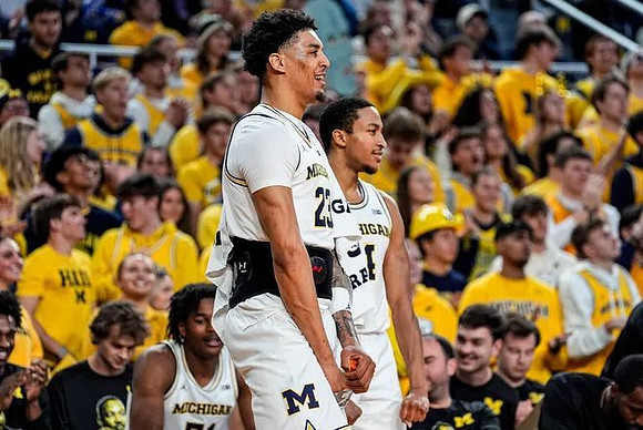 Yaxel Lendeborg (23), Nimari Burnett (4), and Morez Johnson Jr. (51)