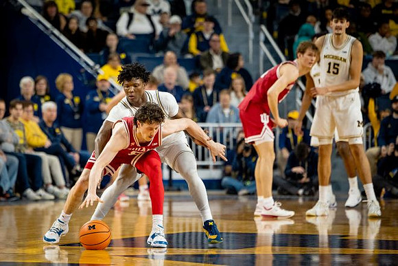 L.J. Cason (2) and Aday Mara (15)