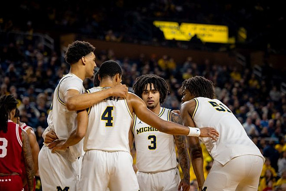 Yaxel Lendeborg (23), Nimari Burnett (4), Elliot Cadeau (3), and Morez Johnson Jr. (51)