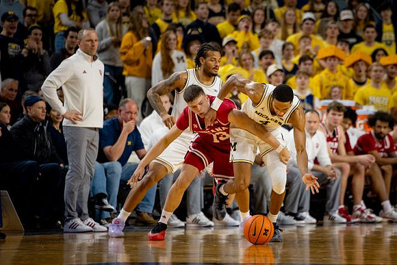 Indiana Head Coach Darian DeVries, Roddy Gayle Jr. (11), and Nimari Burnett (4)