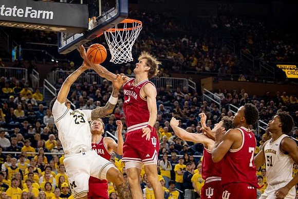 Yaxel Lendeborg (23) and Morez Johnson Jr. (51)