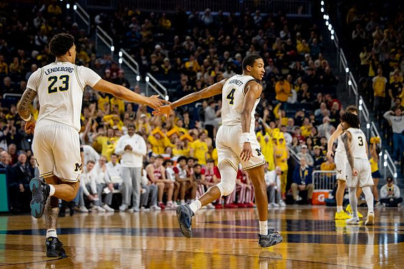Yaxel Lendeborg (23), Nimari Burnett (4), Will Tschetter (42), and Elliot Cadeau (3)