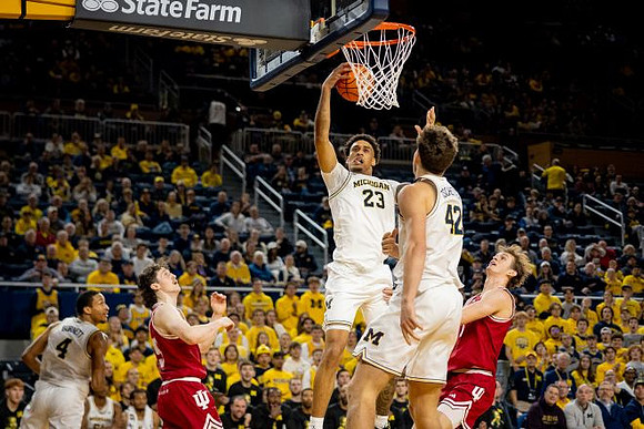 Nimari Burnett (4), Yaxel Lendeborg (23), and Will Tschetter (42)