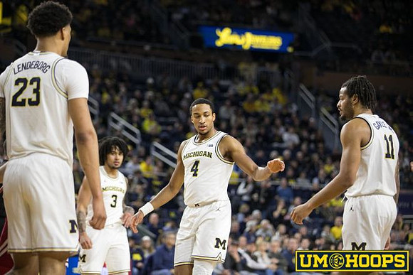 Yaxel Lendeborg (23), Elliot Cadeau (3), Nimari Burnett (4), and Roddy Gayle Jr. (11)