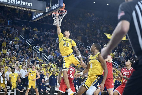 L.J. Cason (2), Will Tschetter (42), Yaxel Lendeborg (23), and Nimari Burnett (4)
