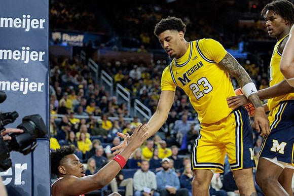 Yaxel Lendeborg (23) and Morez Johnson Jr. (21)