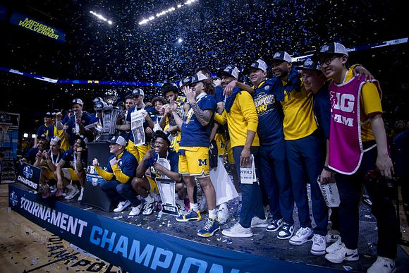 Dusty May, Michigan Team, and Big Ten Tournament Championship Trophy