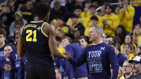 Morez Johnson Jr. (21) and Nebraska Head Coach Fred Hoiberg
