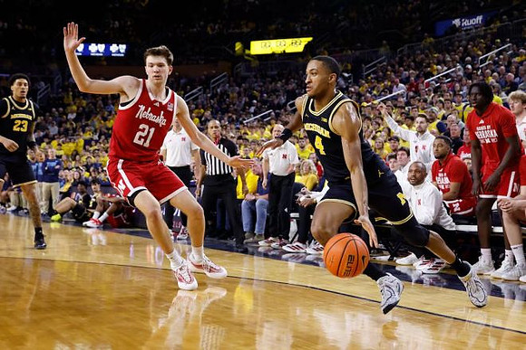 Yaxel Lendeborg (23) and Nimari Burnett (4)