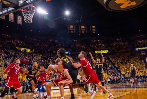 Yaxel Lendeborg (23), Morez Johnson Jr. (21), Elliot Cadeau (3), and Aday Mara (15)