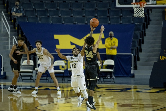 Brandon Johns Jr. (23) and Mike Smith (12)