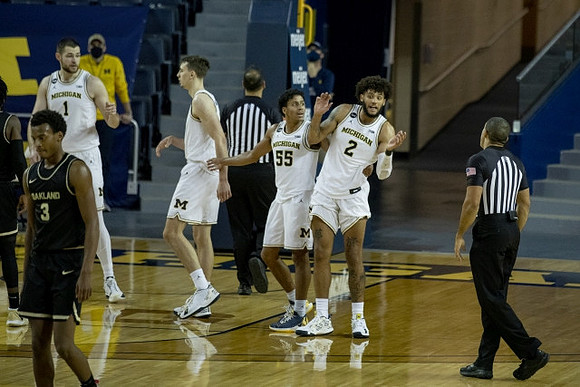 Hunter Dickinson (1), Franz Wagner (21), Eli Brooks (55), and Isaiah Livers (2)