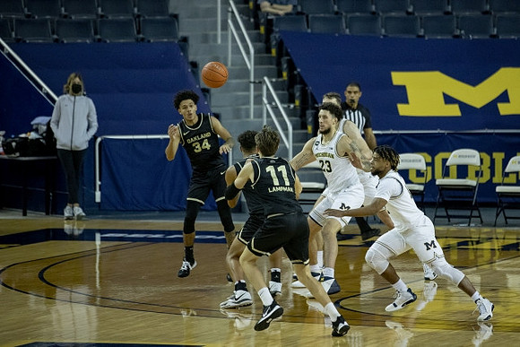 Brandon Johns Jr. (23), Mike Smith (12), and Franz Wagner (21)