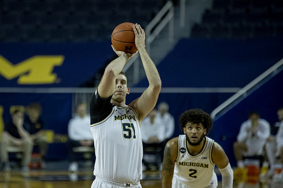 Austin Davis (51) and Isaiah Livers (2)