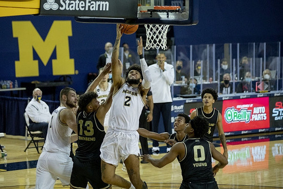 Hunter Dickinson (1), Isaiah Livers (2), and Franz Wagner (21)