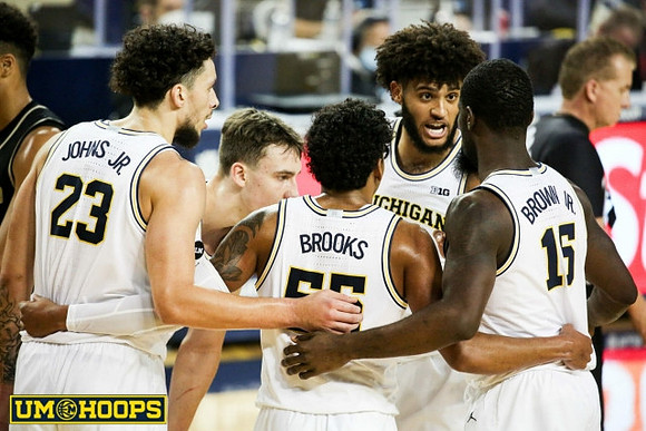 Brandon Johns Jr. (23), Franz Wagner (21), Eli Brooks (55), Isaiah Livers (2), and Chaundee Brown Jr. (15)