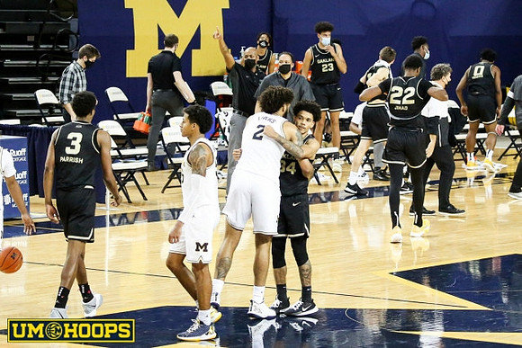 Eli Brooks (55) and Isaiah Livers (2)