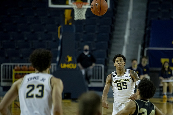 Brandon Johns Jr. (23) and Eli Brooks (55)