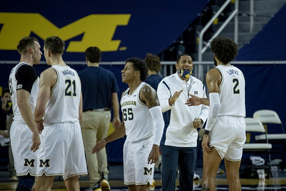 Austin Davis (51), Franz Wagner (21), Eli Brooks (55), Howard Eisley, and Isaiah Livers (2)