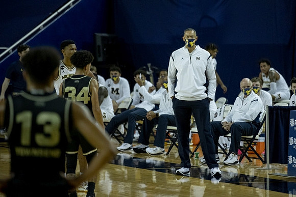 Zeb Jackson (3), Juwan Howard, and Phil Martelli