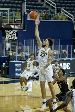 Eli Brooks (55) and Brandon Johns Jr. (23)