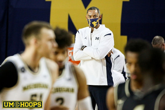 Austin Davis (51), Isaiah Livers (2), and Juwan Howard