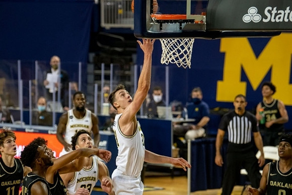 Chaundee Brown Jr. (15), Brandon Johns Jr. (23), and Franz Wagner (21)