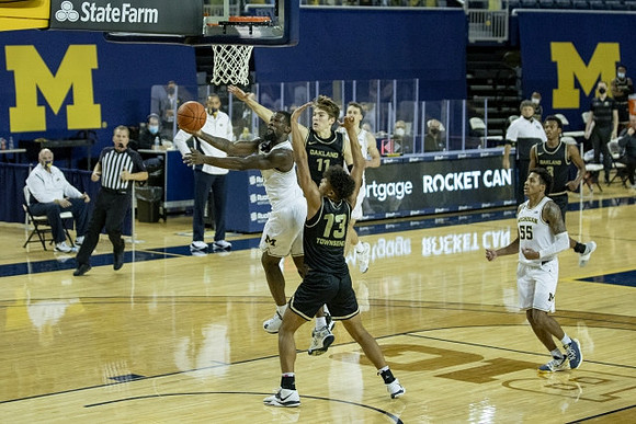 Chaundee Brown Jr. (15) and Eli Brooks (55)