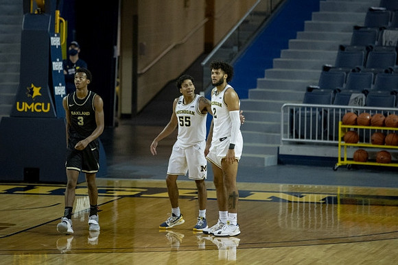 Eli Brooks (55) and Isaiah Livers (2)