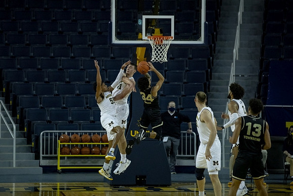 Eli Brooks (55), Franz Wagner (21), Austin Davis (51), and Isaiah Livers (2)