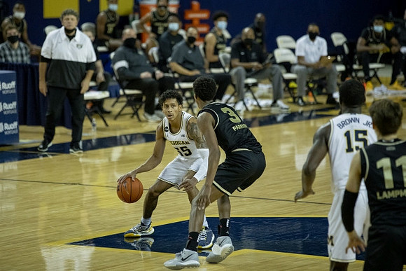 Eli Brooks (55) and Chaundee Brown Jr. (15)