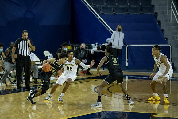 Eli Brooks (55) and Terrance Williams II (5)
