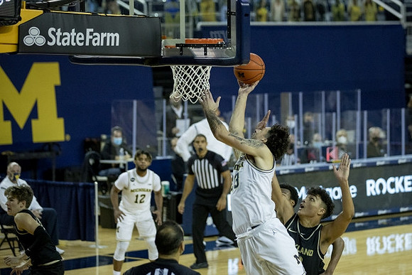 Mike Smith (12) and Brandon Johns Jr. (23)