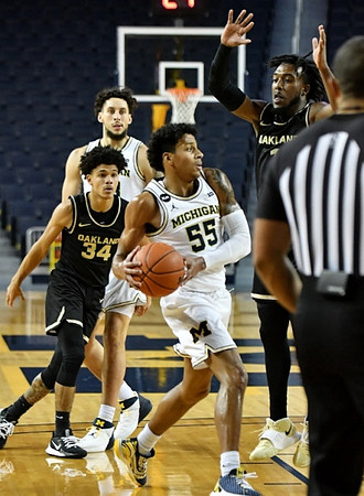 Eli Brooks (55) and Brandon Johns Jr. (23)