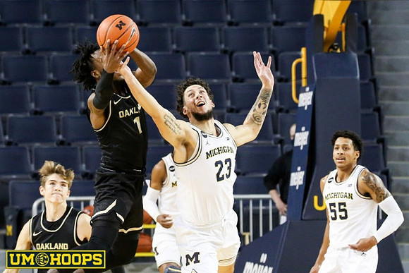 Brandon Johns Jr. (23) and Eli Brooks (55)
