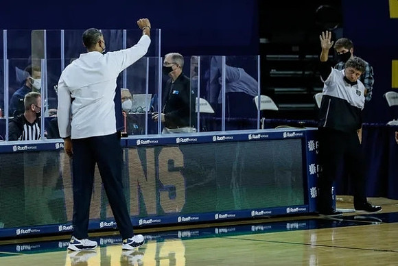 Juwan Howard and Greg Kampe Oakland Head Coach