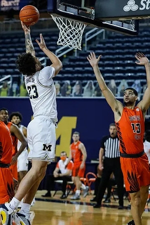Brandon Johns Jr. (23) and Isaiah Livers (2)