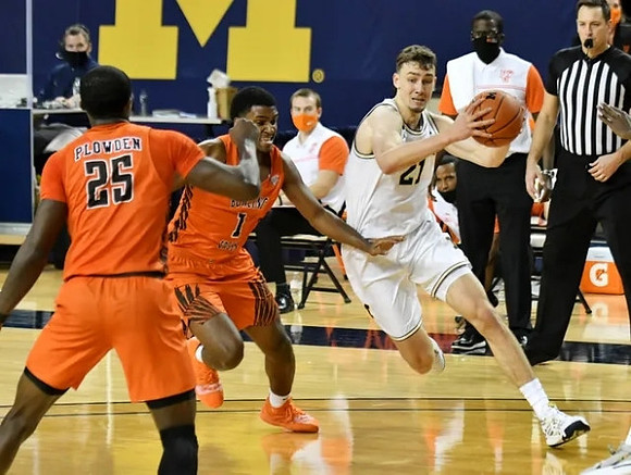 Franz Wagner (21) and Bowling Green Head Coach Michael Huger