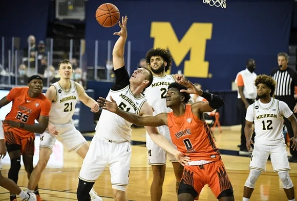 Franz Wagner (21), Austin Davis (51), Isaiah Livers (2), and Mike Smith (12)