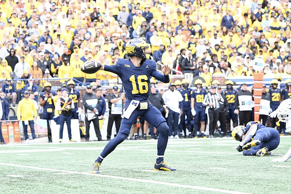 Davis Warren (16) and Donovan Edwards (7)
