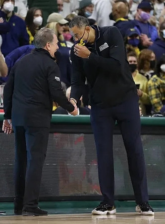 Michigan State Head Coach Tom Izzo and Juwan Howard