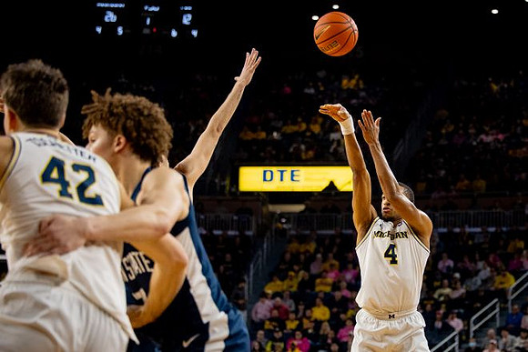 Will Tschetter (42) and Nimari Burnett (4)