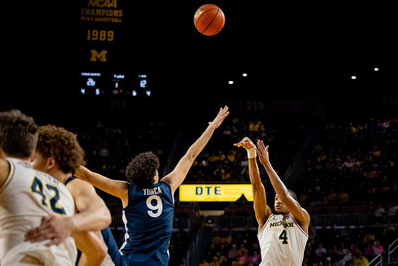 Will Tschetter (42) and Nimari Burnett (4)