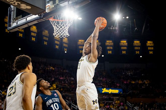 Yaxel Lendeborg (23) and Morez Johnson Jr. (21)
