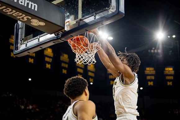 Yaxel Lendeborg (23) and Morez Johnson Jr. (21)