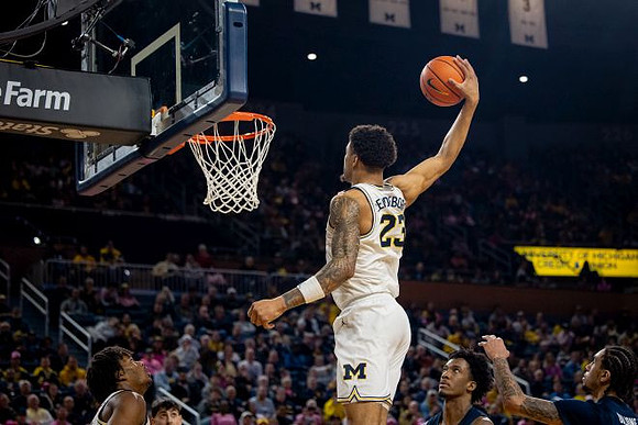 Morez Johnson Jr. (21) and Yaxel Lendeborg (23)